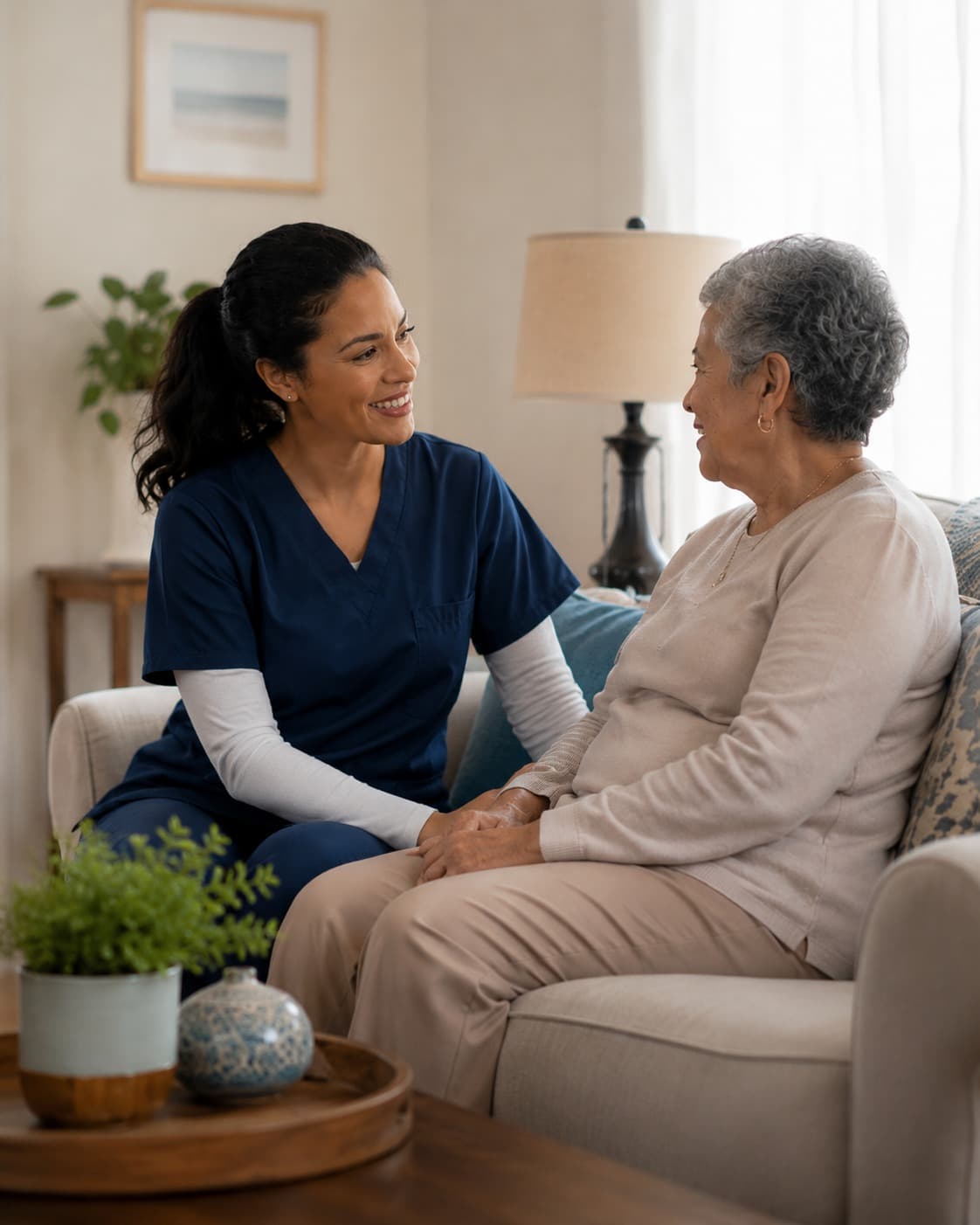 A clinician speaking with an older adult in a home setting.