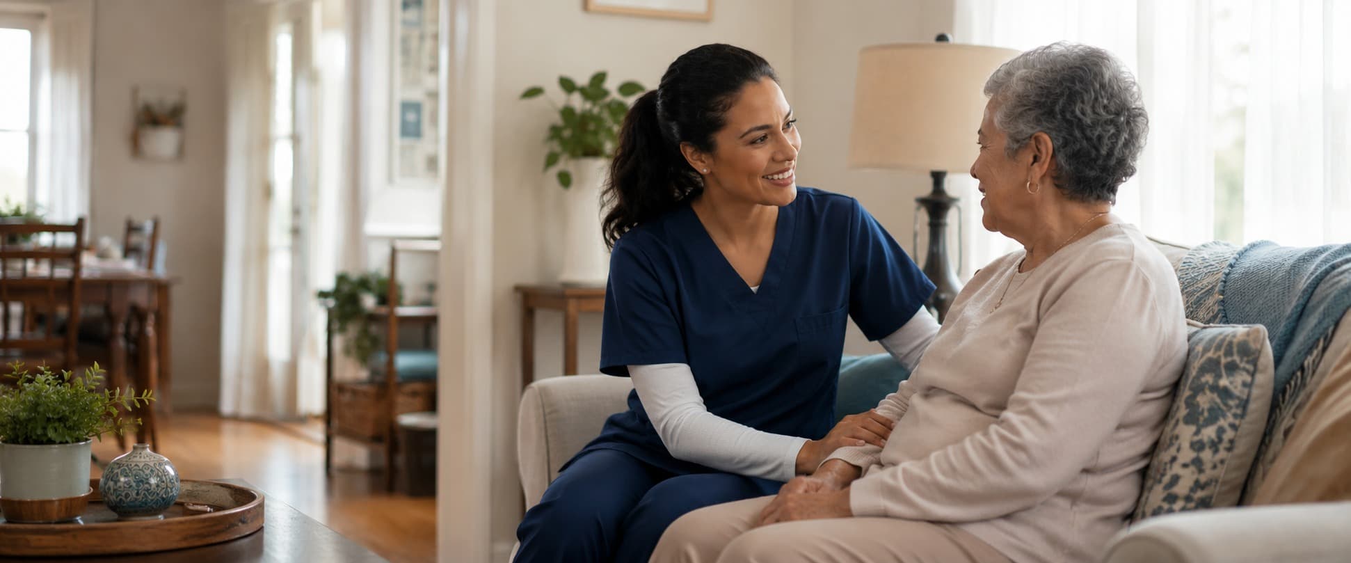 Home health clinician and a patient together in the patient's living room.
